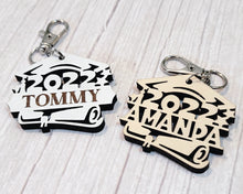 Load image into Gallery viewer, This fashionable and thoughtful Graduation Keychain makes for a perfect personalized graduation keepsake. Laser engraved with 2023, 2024, 2025 or 2026 &amp; your student&#39;s name, it&#39;s the perfect way to remember the momentous occasion for many years to come.
