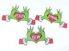 Load image into Gallery viewer, Embrace the humor and charm of the holiday season with our delightful Grouch Hands &amp; Heart Personalized Ornaments – the ultimate gift for the Grouch in your life. Measuring approximately 5&quot; wide x 2.5&quot; long, these ornaments pack a punch of personality and are sure to bring a smile to anyone with a touch of the grumpies.
