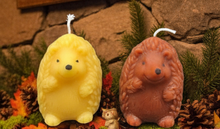 Load image into Gallery viewer, Bring the charm of the forest into your home with this adorable Hedgehog Beeswax Candle! Available in two delightful poses—standing upright or with all four paws on the ground—these highly detailed woodland candles are the perfect addition to any nature-inspired décor.
