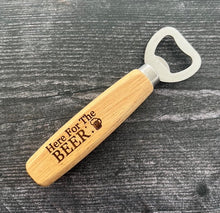 Load image into Gallery viewer, Pop open your favorite beverage in style with our engraved wood-handled bottle openers! Crafted with a durable stainless steel opener and a smooth wooden handle, these openers offer a comfortable grip and a sleek, rustic look.
