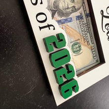 Load image into Gallery viewer, Looking for a unique and thoughtful way to give cash to your favorite graduate? Our Personalized Graduation Money Holder is handcrafted from quality wood and features a bold Cap &amp; 2025 design that can be customized in your choice of colors—perfect for matching school colors or your grad's favorites!
