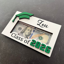 Load image into Gallery viewer, Looking for a unique and thoughtful way to give cash to your favorite graduate? Our Personalized Graduation Money Holder is handcrafted from quality wood and features a bold Cap &amp; 2025 design that can be customized in your choice of colors—perfect for matching school colors or your grad's favorites!
