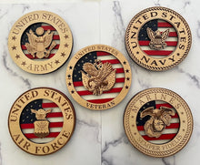 Load image into Gallery viewer, Celebrate the heroes that fought for our freedom with these Military Signs. &nbsp;These 9” round signs display a flag background and your choice of military insignias on the front. &nbsp;The perfect way to thank the veterans or active duty hero’s in your life. &nbsp;
