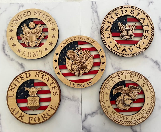 Celebrate the heroes that fought for our freedom with these Military Signs.  These 9” round signs display a flag background and your choice of military insignias on the front.  The perfect way to thank the veterans or active duty hero’s in your life.  