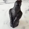 Dark &amp; mysterious, this&nbsp;Raven Beeswax Candle represents a deeper connection between the physical &amp; spiritual world in many cultures. &nbsp;

Because of its black plumage, croaking call, and diet of carrion, the raven is often associated with loss and ill omen. Yet, its symbolism is complex. As a talking bird, the raven also represents prophecy and insight. Ravens in stories often act as psychopomps, connecting the material world with the world of spirits.