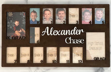 Load image into Gallery viewer, Proudly display your child’s school journey from Kindergarten through High School Graduation all in one beautiful frame. This thoughtfully designed photo frame creates a timeless keepsake you’ll treasure for years to come—watching your child grow, one school year at a time.
