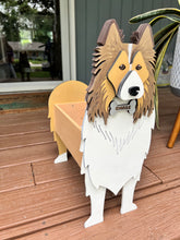 Load image into Gallery viewer, Welcome friends and family with this beautiful handcrafted Sheltie (Shetland Sheepdog) Planter Box! This charming decorative piece is the perfect addition to your front porch, entryway, covered patio, or home décor. It's a wonderful gift for Sheltie owners, dog lovers, birthdays, housewarmings, or any special occasion.

