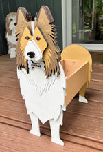 Load image into Gallery viewer, Welcome friends and family with this beautiful handcrafted Sheltie (Shetland Sheepdog) Planter Box! This charming decorative piece is the perfect addition to your front porch, entryway, covered patio, or home décor. It's a wonderful gift for Sheltie owners, dog lovers, birthdays, housewarmings, or any special occasion.
