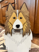 Load image into Gallery viewer, Welcome friends and family with this beautiful handcrafted Sheltie (Shetland Sheepdog) Planter Box! This charming decorative piece is the perfect addition to your front porch, entryway, covered patio, or home décor. It's a wonderful gift for Sheltie owners, dog lovers, birthdays, housewarmings, or any special occasion.
