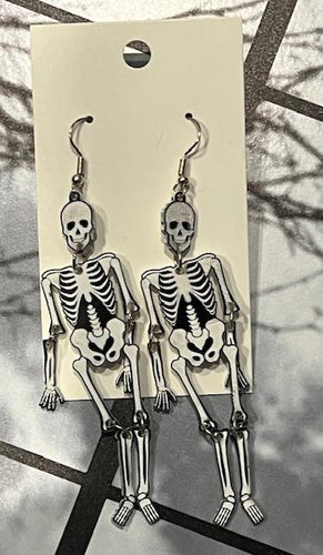 Introducing our stunning dangle skeleton earrings that are sure to turn heads and make a statement wherever you go. Crafted with intricate attention to detail, these earrings feature a unique design that allows the arms and legs of the skeleton to swing freely, adding an extra element of movement and fun to your look.