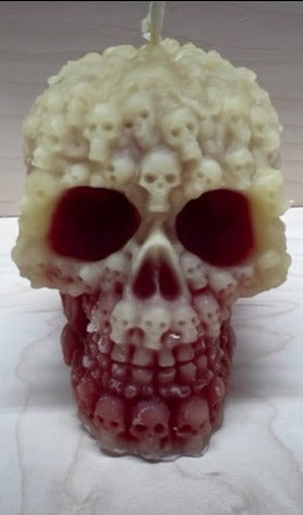 This Skull Covered in Skulls Beeswax Candle is the perfect addition to your Halloween decor!  Large creepy skull covered in small skulls.   Approx 7 oz., 3
