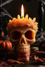 Load image into Gallery viewer, Add a hauntingly beautiful touch to your home with this Leaf Crown Skull Beeswax Candle. Featuring an intricately detailed skull adorned with a crown of leaves, this unique candle is perfect for lovers of gothic décor, Halloween decorating, dark cottagecore, and spooky home accents.
