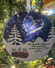 Load image into Gallery viewer, This beautiful The Sky Looks Different ornament is sure to become a cherished memorial to those we love.&nbsp; The background is made of transparent blue acrylic or stary sky acrylic to allow the light to shine through the ornament for a beautiful remembrance.&nbsp; Available in 2 styles and may be customized.
