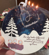 Load image into Gallery viewer, This beautiful The Sky Looks Different ornament is sure to become a cherished memorial to those we love.&nbsp; The background is made of transparent blue acrylic or stary sky acrylic to allow the light to shine through the ornament for a beautiful remembrance.&nbsp; Available in 2 styles and may be customized.
