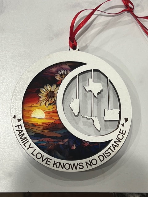 This beautiful ornament is sure to be the highlight of your long distance, loved ones Christmas, holiday or seasonal celebration.  Add up to 4 states (other countries are available upon request).  Features stained glass style acrylic on one side & up to 4 states on the opposite side.  Also makes a great Mother's Day or Father's Day gift.