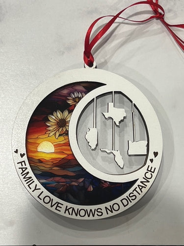 This beautiful ornament is sure to be the highlight of your long distance, loved ones Christmas, holiday or seasonal celebration.  Add up to 4 states (other countries are available upon request).  Features stained glass style acrylic on one side & up to 4 states on the opposite side.  Also makes a great Mother's Day or Father's Day gift.