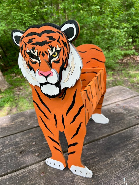 Bring some feline charm to your home with our adorable Tiger Planter. Welcome guests with its cute design. The perfect gift for animal lovers, this planter is sure to bring a smile to anyone's face. 