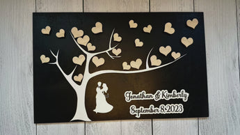 Our Exquisite Wedding Guest Book Alternative – the perfect way to capture and cherish the memories of your special day! This beautifully crafted 12" x 19" plaque is a unique addition to your wedding, offering a treasured keepsake that celebrates your love in a personalized and memorable way. A stunning image of the wedding couple, elegantly displayed alongside their names and wedding date is the focal point of your keepsake
