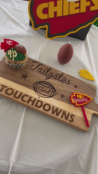 Tailgates and Touchdowns Charcuterie Board.  Picture of football in the middle.  
