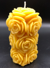 Load image into Gallery viewer, 4 1/4&quot; Rose Beeswax Candle.  This beeswax candle is decorated with roses carved into the sides and top of the candle.

