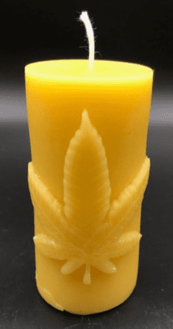 Leaf design beeswax candle. Leaf design on front of this candle shown with green sparkle mica leaf.