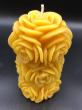 Load image into Gallery viewer, 4 1/4&quot; Rose Beeswax Candle. This beeswax candle is decorated with roses carved into the sides and top of the candle.
