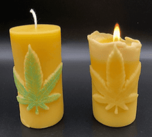 Load image into Gallery viewer, Leaf design beeswax candle. Leaf design on front of this candle shown with green sparkle mica leaf.
