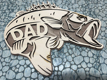 Load image into Gallery viewer, Surprise that fisherman in your life with this incredibly detailed Bass Sign.  Choose the wording you&#39;d like inside to read Dad, Grandpa, Papa, Uncle or you can choose to not have any writing at all.  Front made with Maple &amp; the backer is Walnut.  Makes an incredible birthday or Father&#39;s Day gift.

