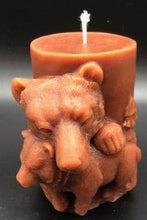 Load image into Gallery viewer, Mama and baby bear beeswax candle. All natural, sourced from an American, family owned apiary. Handmade in the USA. This Mama and Baby Bear beeswax candle looks absolutely stunning in any room when lit, as the soft glow lights up the cuddling duo. The scene wraps around the entire candle with images of bears in the wilderness. A wonderful compliment to any cabin or rustic design or as a gift to the outdoorsy types in your life.  Brown shown.
