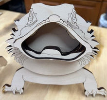 Load image into Gallery viewer, Let this adorable Bearded Dragon Eyeglass Holder keep your glasses safe.    Approx. 7&quot; wide x 5&quot; long.  Comes unpainted.  Leave as is or add your own custom touch by painting it yourself.  
