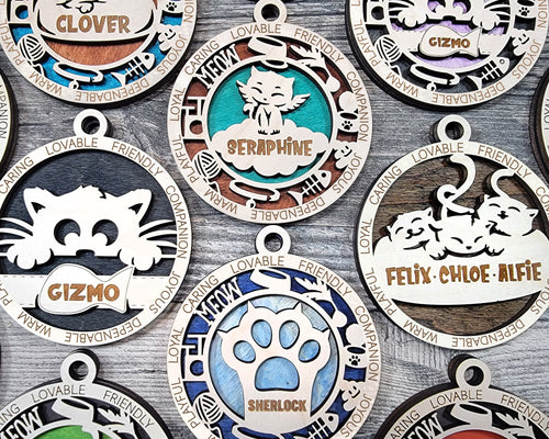 Share the love for our furry friends with these beautiful cat ornaments!  7 different options available.  Send us the name you'd like personalized on it & we'll add it to your ornament.  Please let us know if you'd like a certain background color