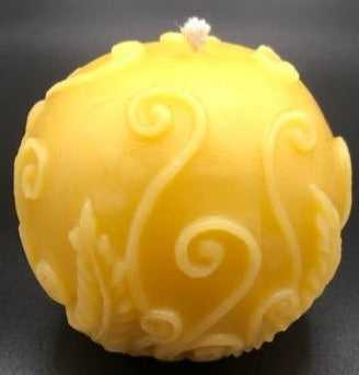 Adorable all natural beeswax ball candle with fern leaves and fiddleheads adorning the sides. Handmade in the USA.