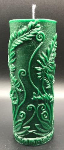 Elegant all natural beeswax pillar candle with fern leaves and fiddleheads adorning the sides. Handmade in the USA.  Green shown.  Also available in natural yellow beeswax.