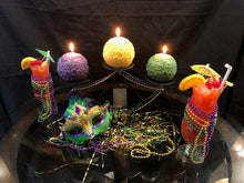 Load image into Gallery viewer, Fleur de Lis Beeswax Ball Candles in fun Mardi Gras colors of purple, green &amp; gold.  Centerpiece design perfect for Mardi Gras dinners and parties.
