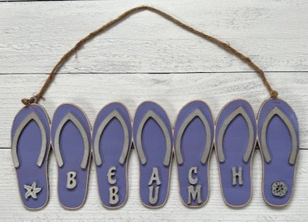 https://fairyforged.com/cdn/shop/products/FlipFlopDoorHanger-WelcomeSign-Purple2_435x.jpg?v=1677601741