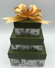 Load image into Gallery viewer, Small gift box trio. Set of 3 gift boxes stacked &amp; tied with a bow. Set includes a beeswax candle, body butter, and a lotion bar. All wrapped &amp; ready to give to your loved ones.

