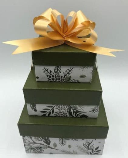 Small gift box trio. Set of 3 gift boxes stacked & tied with a bow. Set includes a beeswax candle, body butter, and a lotion bar. All wrapped & ready to give to your loved ones.
