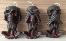 Load image into Gallery viewer, Each candle measures 4&quot; tall x 2 3/16&quot; wide, and weighs approximately 2 ounces, makin them the perfect size for any room in your home.  The three skulls feature a unique design, embodying the classic &quot;see no evil, hear no evil, speak no evil&quot; phrase.
