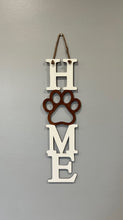 Load image into Gallery viewer, Welcome everyone (especially the fur babies) into your home with this adorable sign!  The purr-fect gift for your pet loving friends &amp; loved ones!      Approximately 19” long x 6” wide (not including hanging rope)
