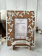 Load image into Gallery viewer, This Hummingbird Photo Frame is the perfect way to display your cherished memories with loved ones.  This unique and personalized photo frame can be customized with up to 20 names in the hearts hung around the frame and custom wording in the banner across the bottom, making it a special and meaningful addition to any home decor.  Available for a 4&quot; x 6&quot; or a 5&quot; x 7&quot; photo.
