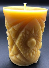 Load image into Gallery viewer, Kaleidoscope design adorns the sides of this pillar type all natural beeswax candle. Handmade in the USA.
