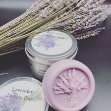 Load image into Gallery viewer, Lavender themed gift basket all ready to deliver to your loved ones. Basket includes a body butter, a lotion bar, a bath bomb, an all natural beeswax candle (unscented) &amp; a soap bar. An additional body butter or bath product can be substituted for the candle. Handmade in the USA.
