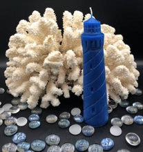 Load image into Gallery viewer, Evoke the beauty of the beach all year long with my 100% beeswax Lighthouse candle. This candle would look great in a nautical themed living space or even a home office. When lit, each candle emits the rich scent of honey and gives off an alluring glow. Perfect as a gift for the beach lover in your life. Bring a bit of the sea to them! Blue shown. Also available in natural yellow beeswax.
