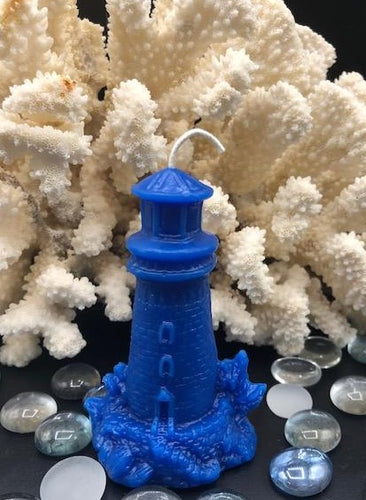 This Lighthouse beeswax candle takes you back to the sea & promises to bring images of the seashore to your dreams.  Perfect for nautical or coastal themed decor or as a gift to the beach lover in your life.  Allow this stunning candle to envelop your room in a warm glow with a sweet honey aroma.  Shown in blue.  Also available in natural yellow beeswax.  