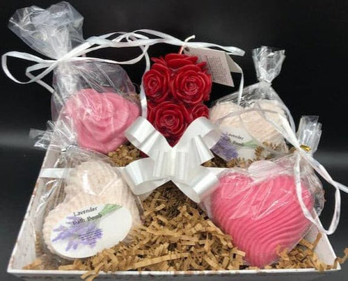 This beautiful gift basket is sure to brighten anyone's day!  Packed full of amazing products to sooth away that special someone's cares & let them know they're always in your heart.  Set contains one red rose beeswax pillar candle, two goat's milk soaps and two heart shaped Lavender Bath Bombs.  All packed up and ready to go.  Perfect for Mother's Day gifts, Birthday gifts, Valentine's Day gifts, Engagement or Wedding gifts or just to let someone know you're thinking of them.  