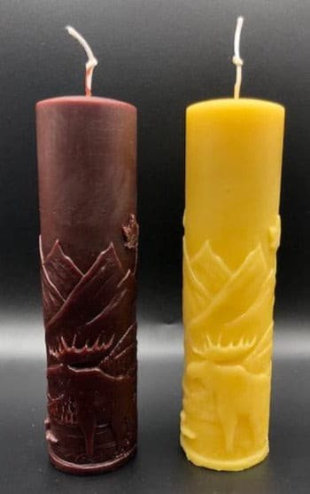 Moose nature scene beeswax candle with mountains, leaves, birds, a stream and the wilderness in the background.