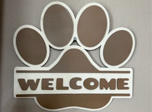 Load image into Gallery viewer, Welcome all pet lovers to your home with this adorable Paw Print Welcome Sign.  Makes a great door hanger or wall hanging.  The purr-fect gift for all pet lovers!
