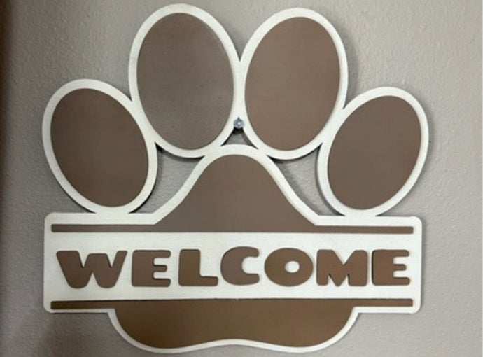 Welcome all pet lovers to your home with this adorable Paw Print Welcome Sign.  Makes a great door hanger or wall hanging.  The purr-fect gift for all pet lovers!