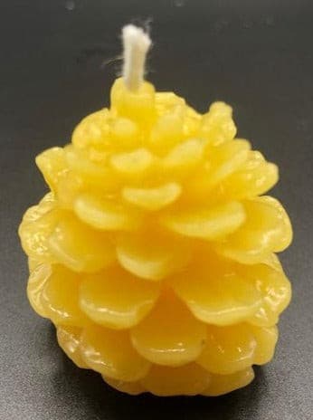 All natural, pure beeswax small pinecone shaped beeswax candle.  Great for fall decorating.  We do not add any fragrance or dye to any of our candles. Beeswax has a natural, sweet honey scent, burns longer, and is non-toxic. Hand-poured candles makes a great homemade eco-friendly gift. Beeswax sourced from directly from an American, family owned apiary. 100% Cotton Wicks. ALL of our candles are 100% American Beeswax made with 100% Cotton wicks.