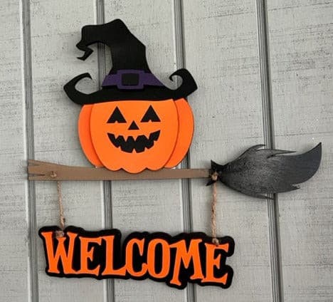 This Pumpkin on a Witch Broom Welcome sign is sure to put a smile on your guest faces this fall.